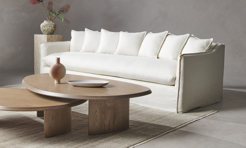 white sofa with two low medium toned wood coffee tables