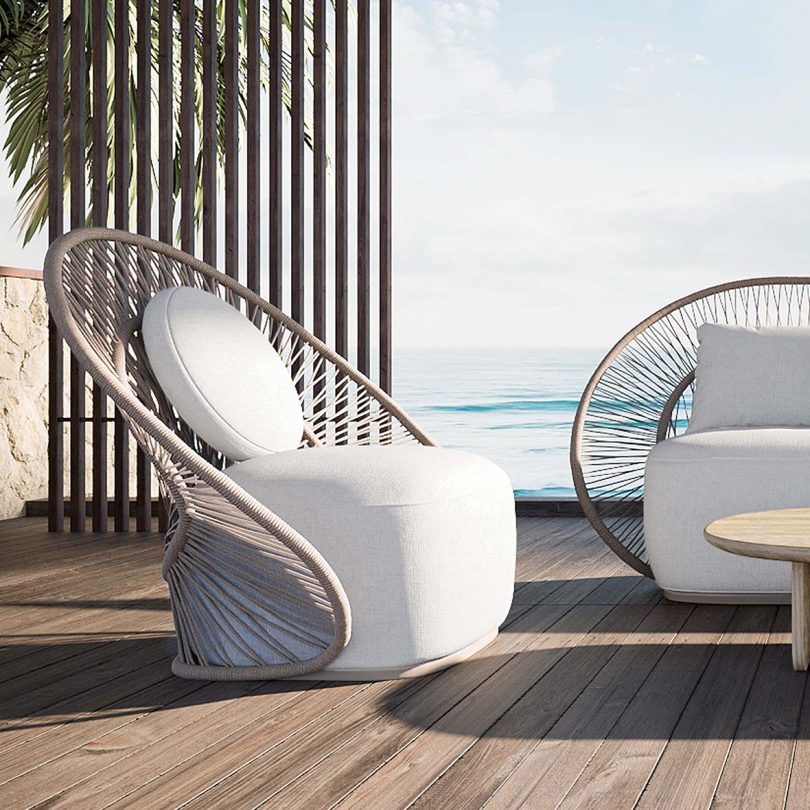 woven rope outdoor furniture on a deck overlooking water
