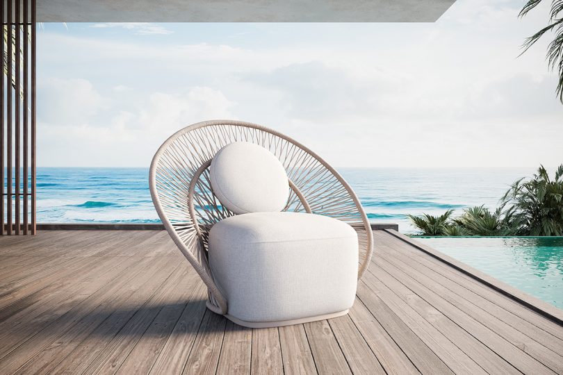 woven rope outdoor chair on a deck overlooking water