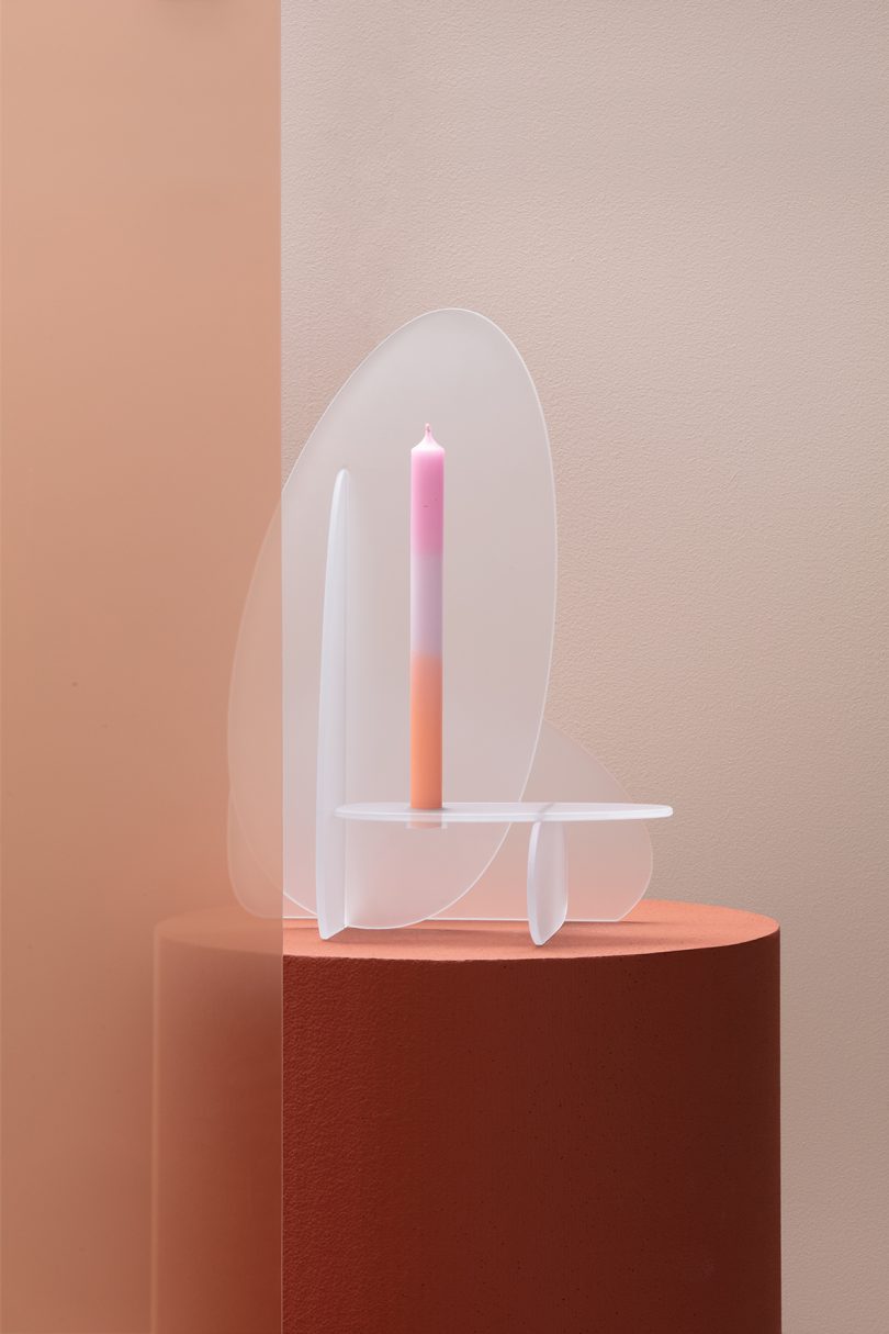 frosted glass candleholder with tri-tone candle on plinth