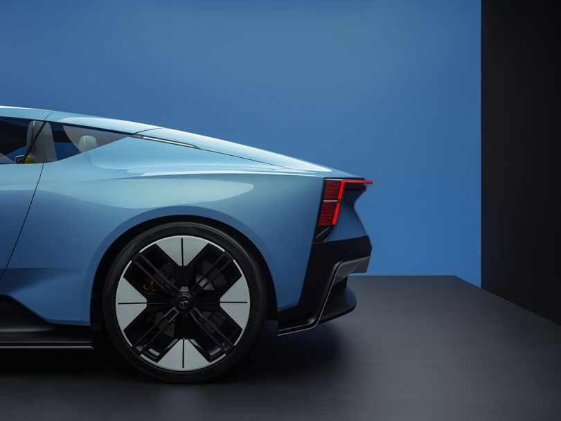 Section rear side view of Polestar 6 in sky blue finish showing 21-inch wheels.