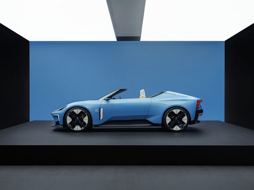 Side view of entire Polestar 6 parked on platform with top down.