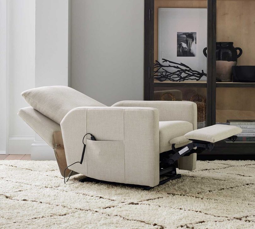 cream colored power lift recliner in the laid out position