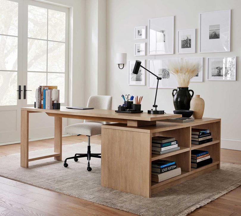 light wood L-Shaped desk styled in a home office