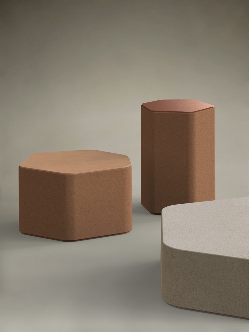 three hexagonal outdoor tables of varying natural shades and sizes