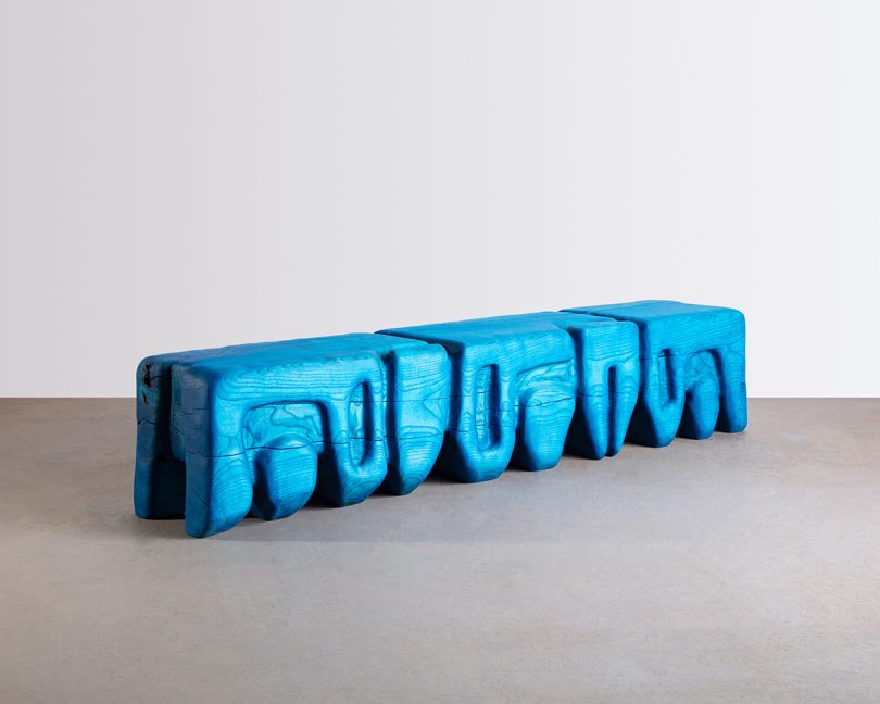 long sculptural bench in bright blue