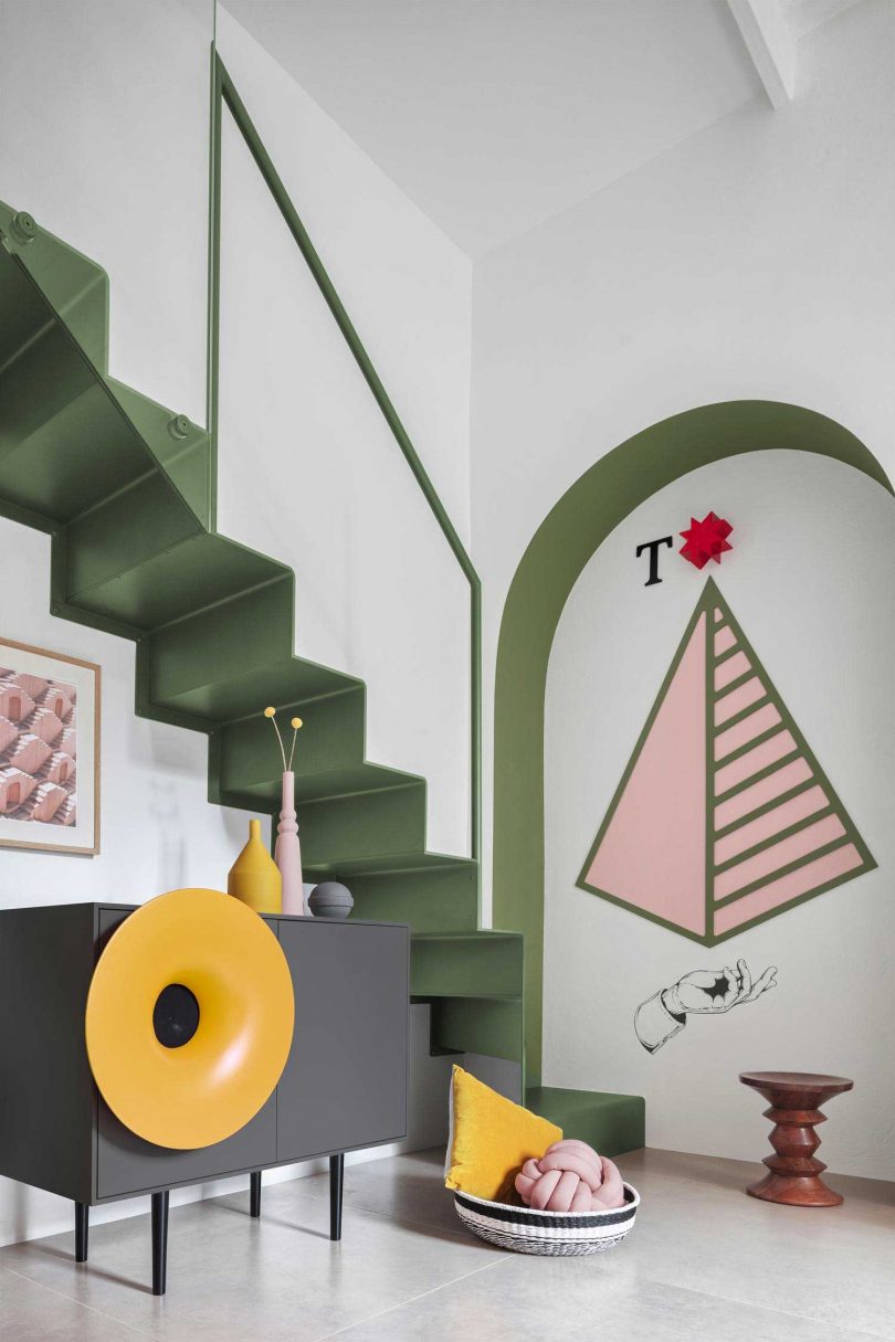 closeup of modern apartment interior with colorful furnishings that give nod to the Memphis movement and Ettore Sottsass