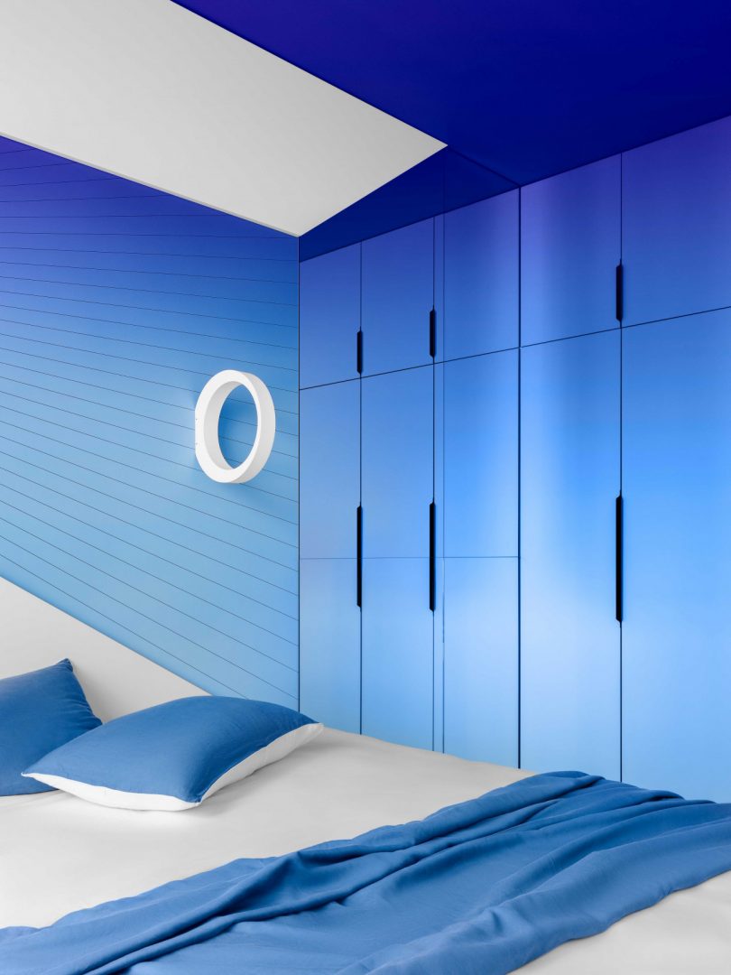 interior view of modern bedroom with gradient shades of blue