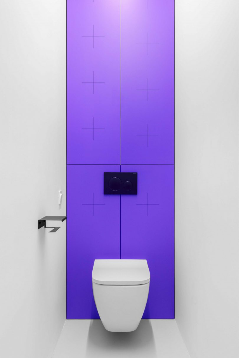 interior view of white bathroom with purple accents