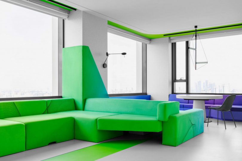 interior view of modern apartment living room with view of bright green sofa
