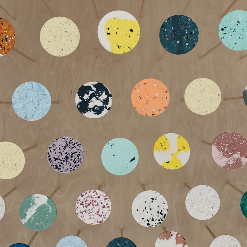 circular discs featuring different colors and patterns of terrazzo