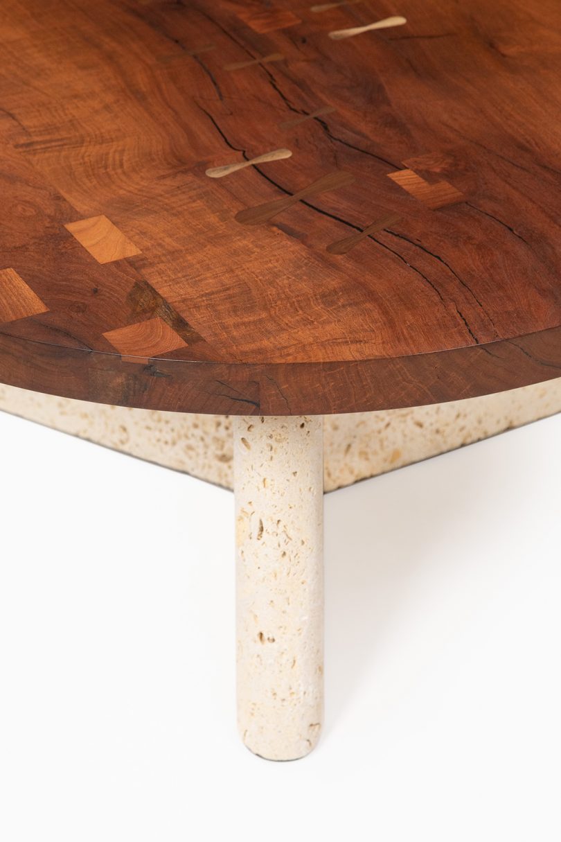 detail of round two-tone wood tripod table