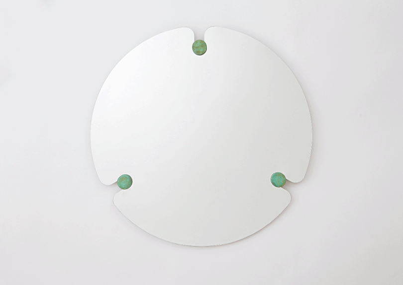 round frameless mirror on white background