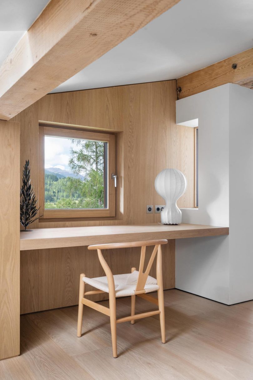 interior shot of light-filled penthouse apartment with light woods and white surfaces