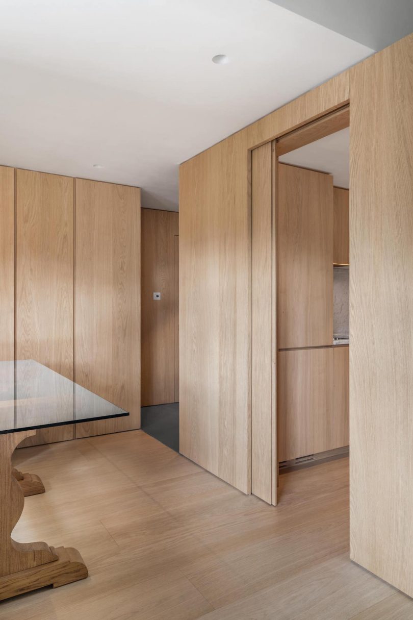 interior shot of light-filled penthouse apartment with light woods and white surfaces