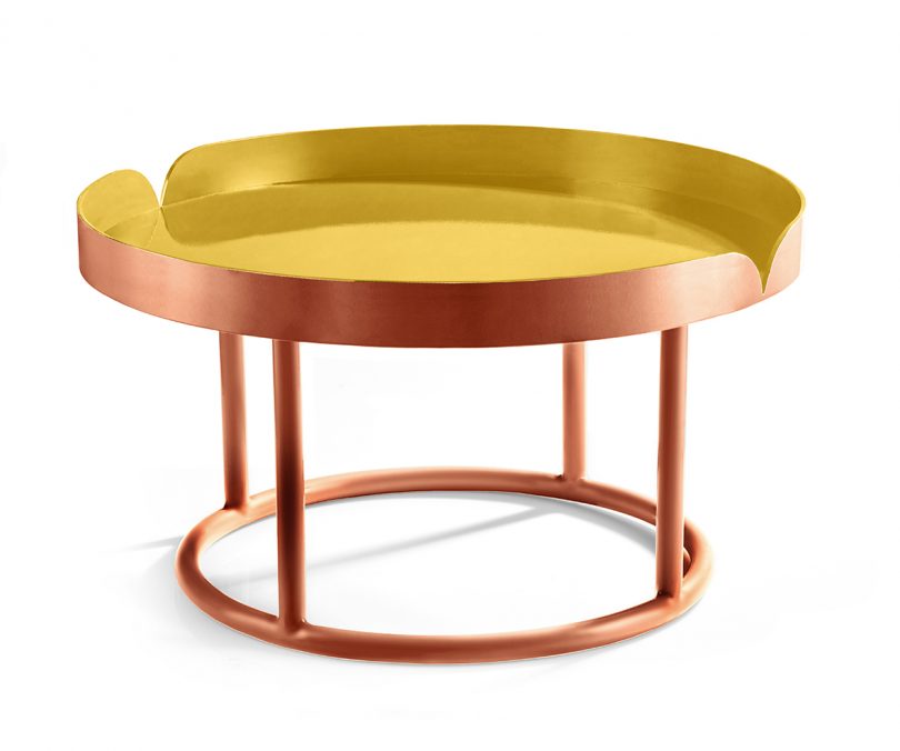 copper and yellow side table on white background