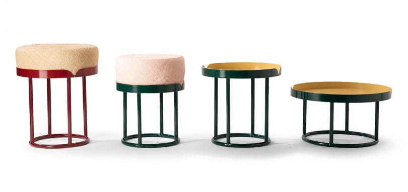 four colorful side tables lined up on white background