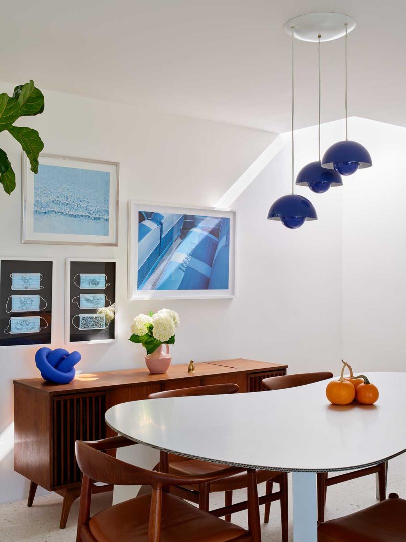 corner shot of modern dining room with royal blue accents