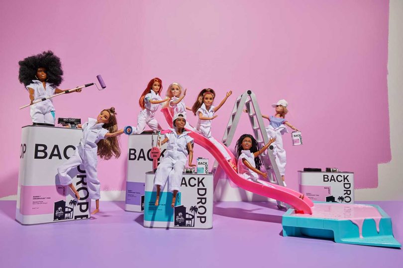 set featuring Barbie dolls riding down slide