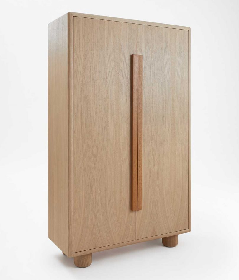 light wood armoire on a white background