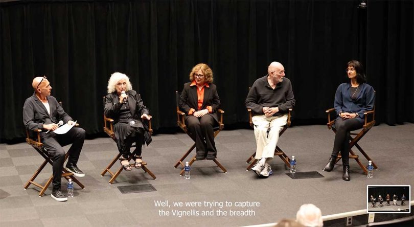 stage view of five people sitting during a discussion panel