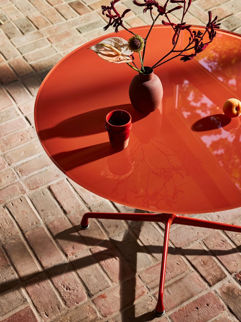 down shot of Eames red dining table by HAY