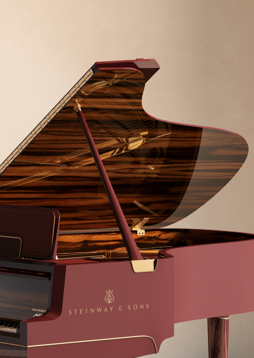 detail of maroon colored grand piano
