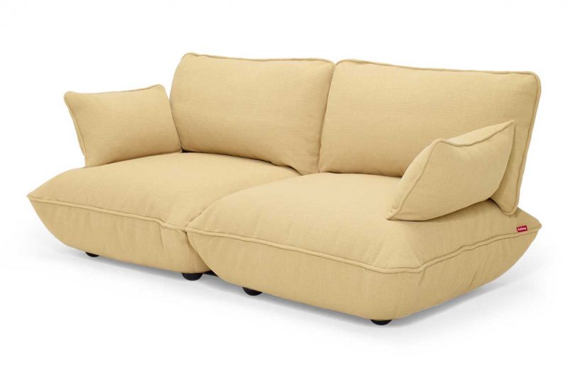 light yellow 2-seater upholstered sofa on white background