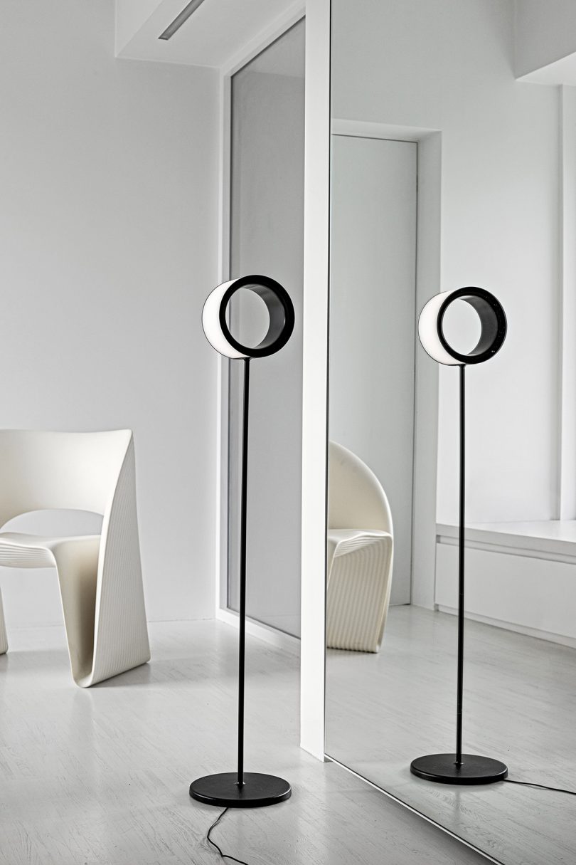 minimal floor lamp with hollow ring in a styled interior space