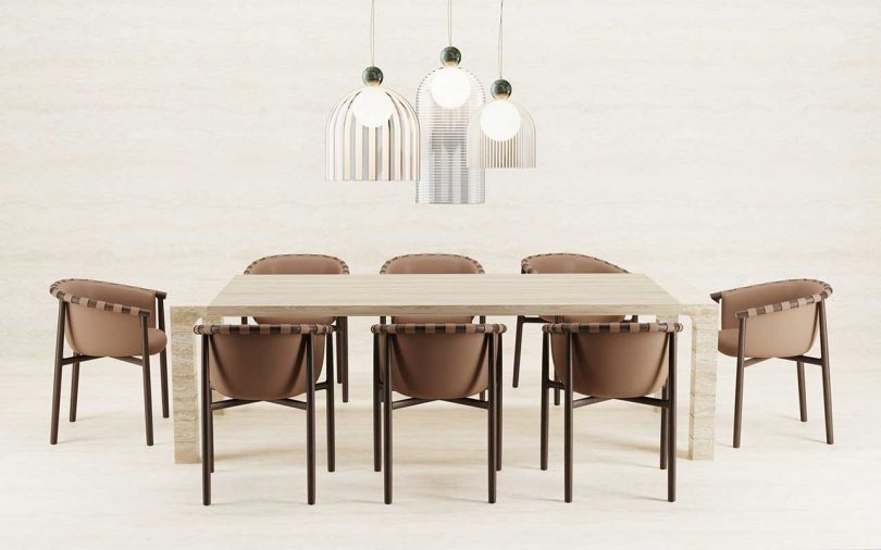 dining table with eight chairs and three domed ceiling lamps