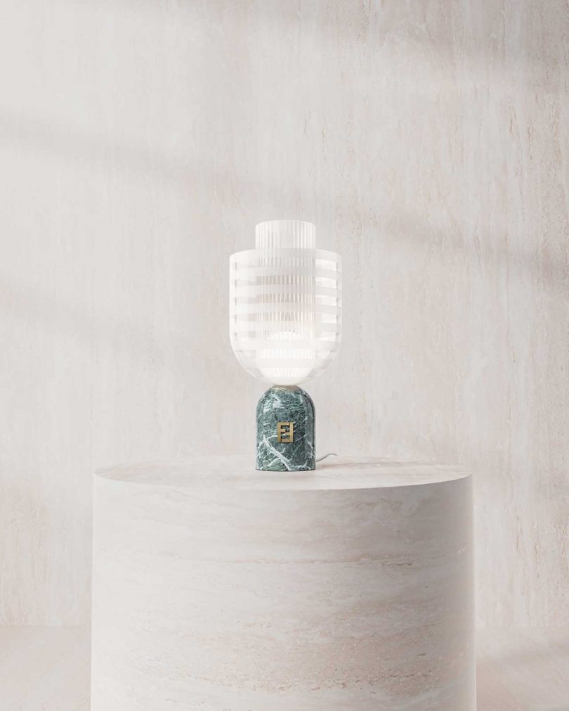 glass table lamp in front of a blank wall