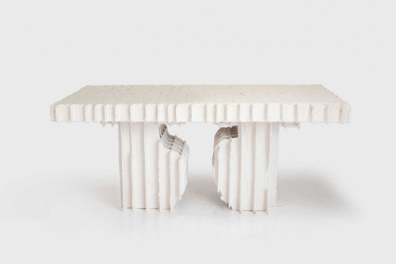 white plaster dining table on a white background