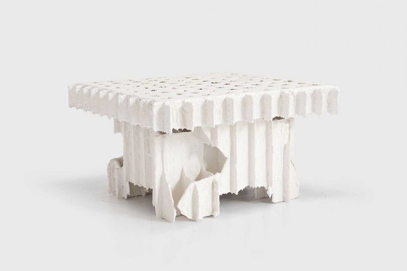 white plaster coffee table on a white background