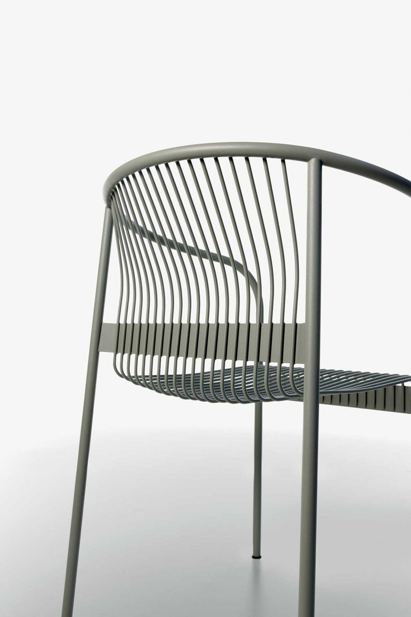 detail of wire armchair on white background