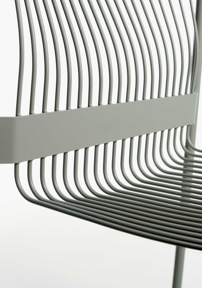 detail of a wire armchair on white background