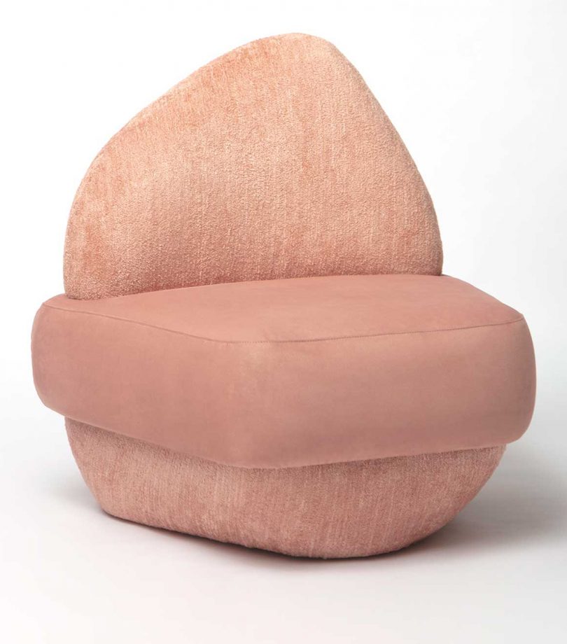 rounded pink chair on white background
