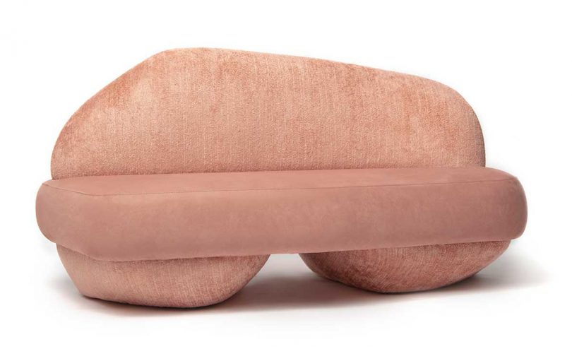 rounded pink sofa on white background