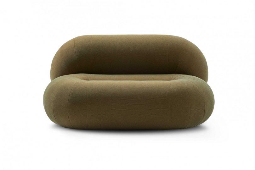 loop-shaped olive green sofa on white background
