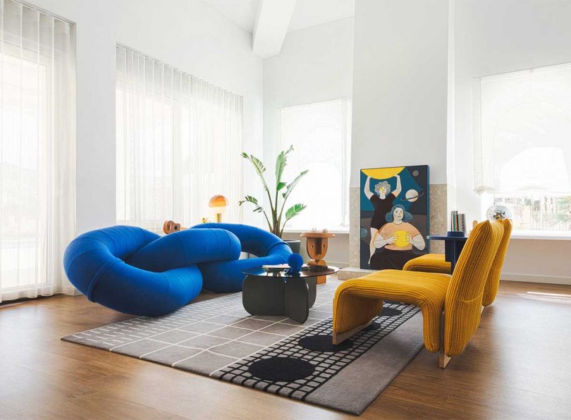abstract royal blue sofa in a styled living space