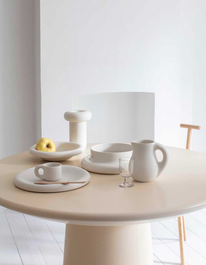 round table with chunky white ceramic dinnerware