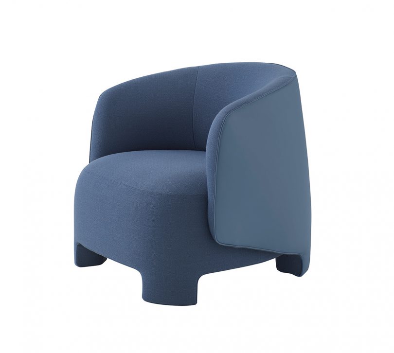 blue upholstered armchair on white background