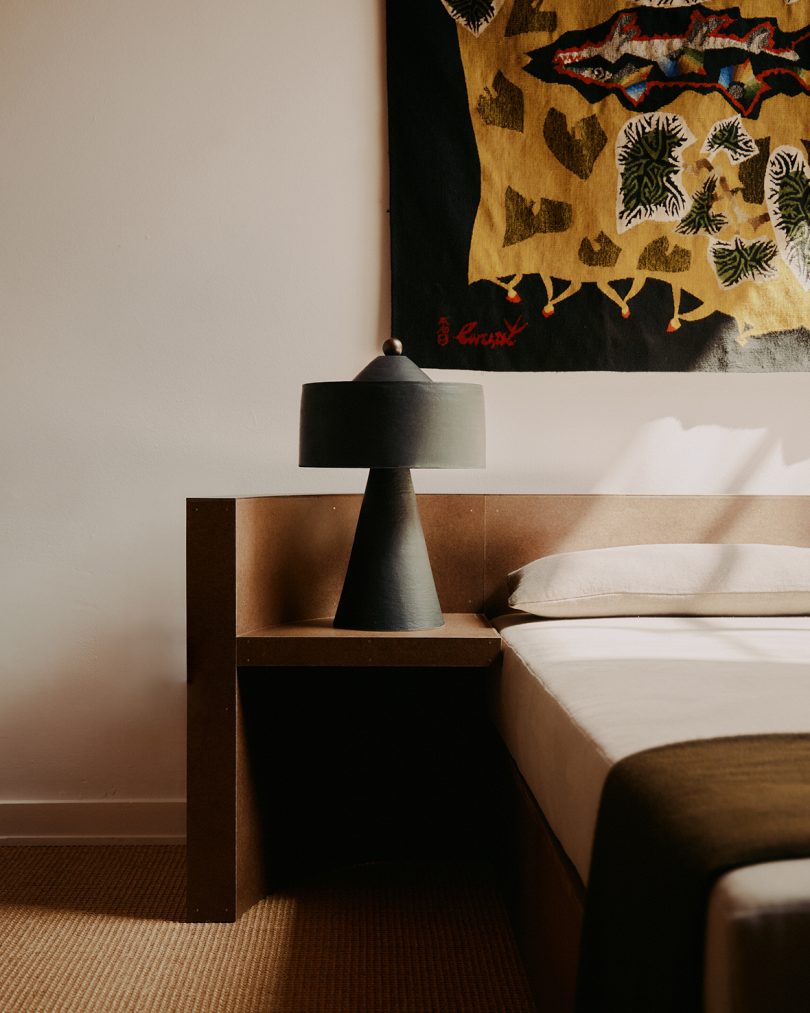 dark table lamp in styled bedroom space