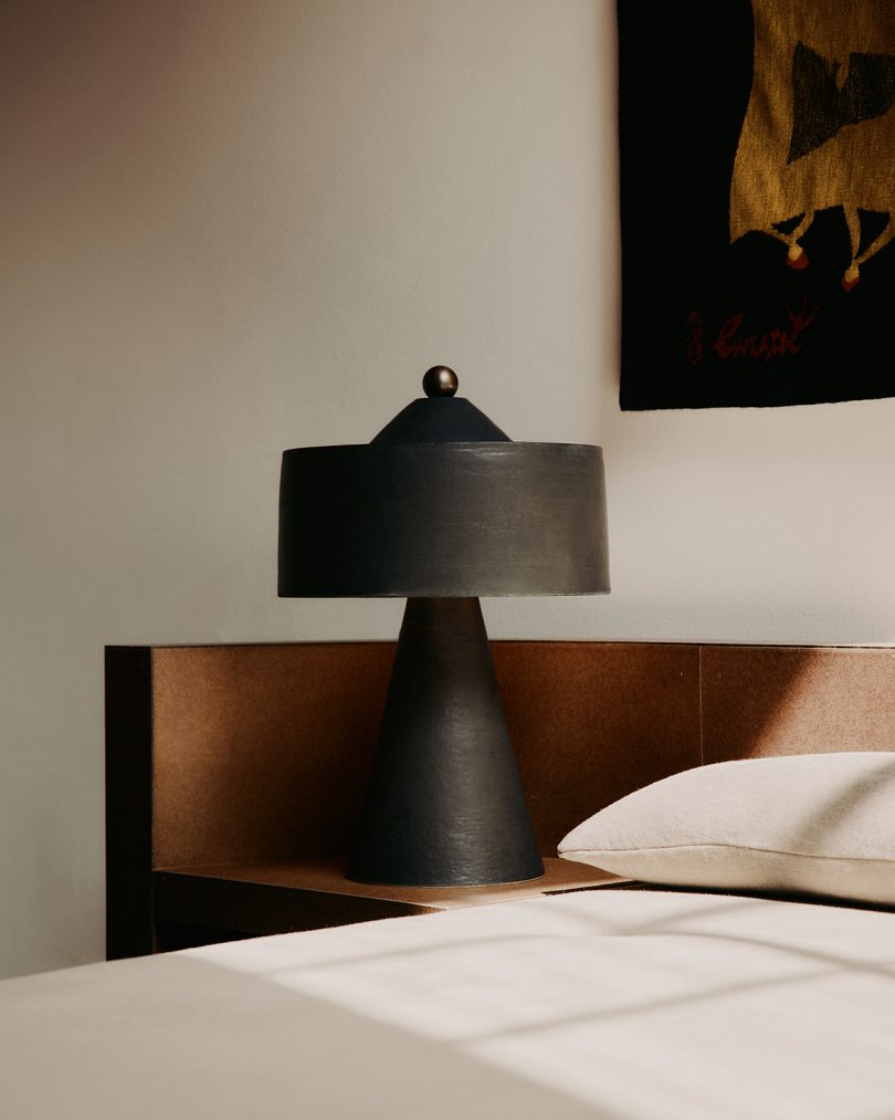 dark table lamp in styled bedroom space