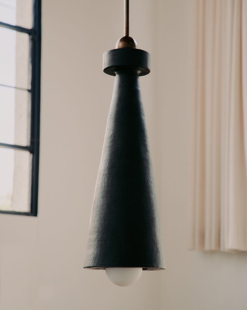 long cone-shaped dark pendant light