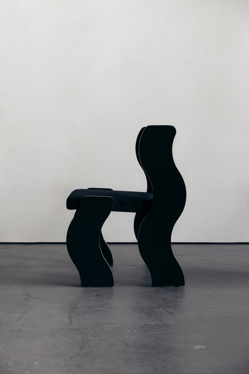 black chair with wavy legs