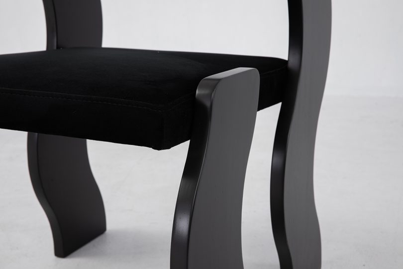 detail of black chair with wavy legs