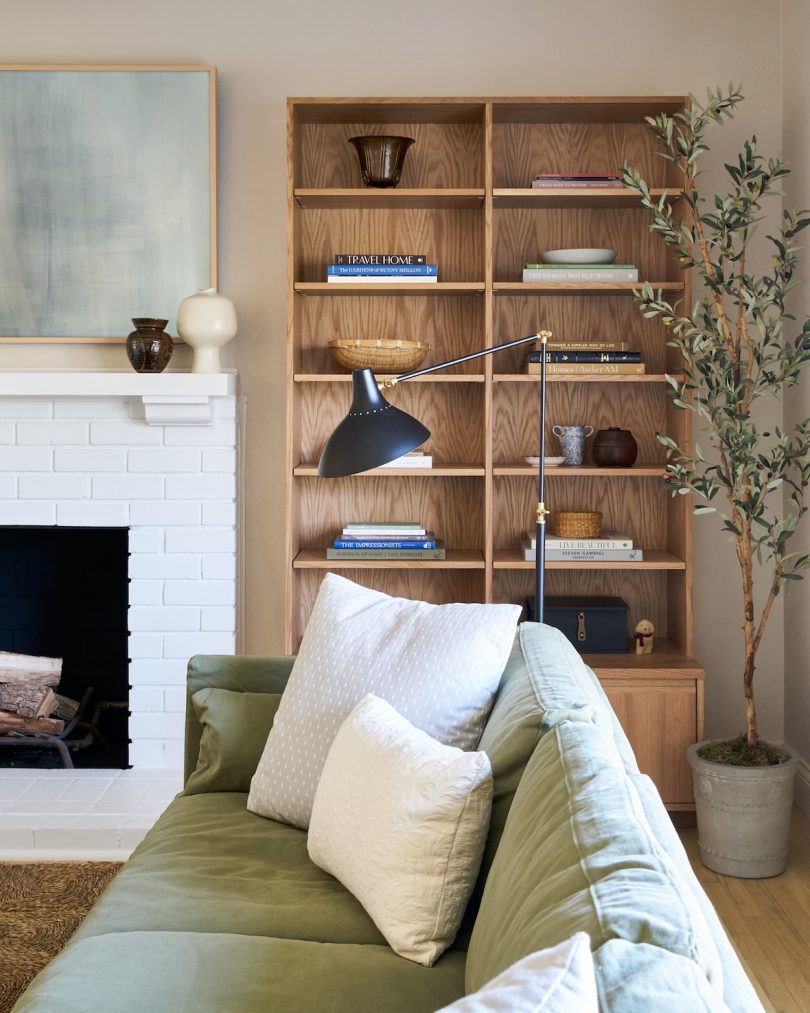 green sofa and bookcase