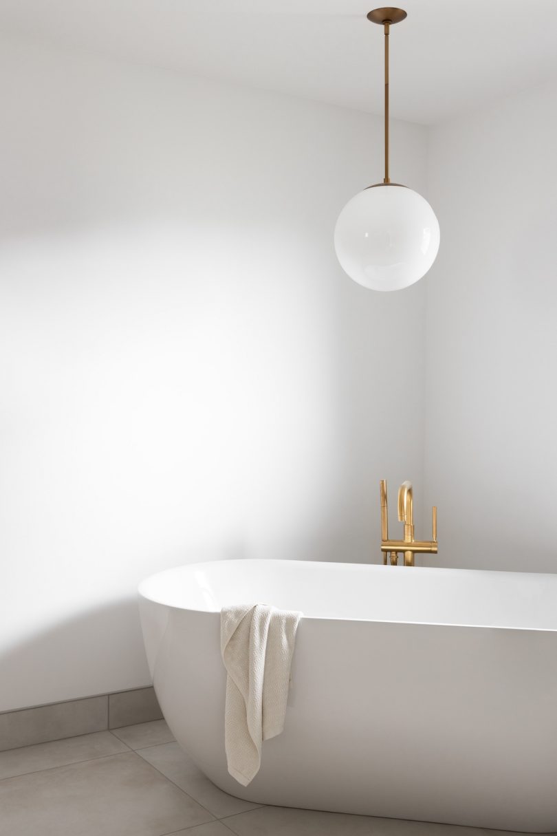 Bathtub underneath round hanging pendant