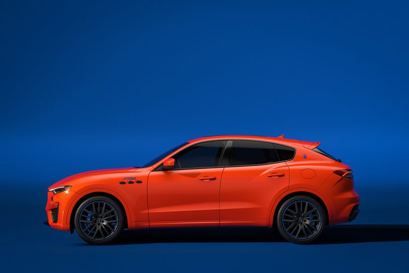 Side profile view of orange The Maserati Levante F Tributo Special Edition.