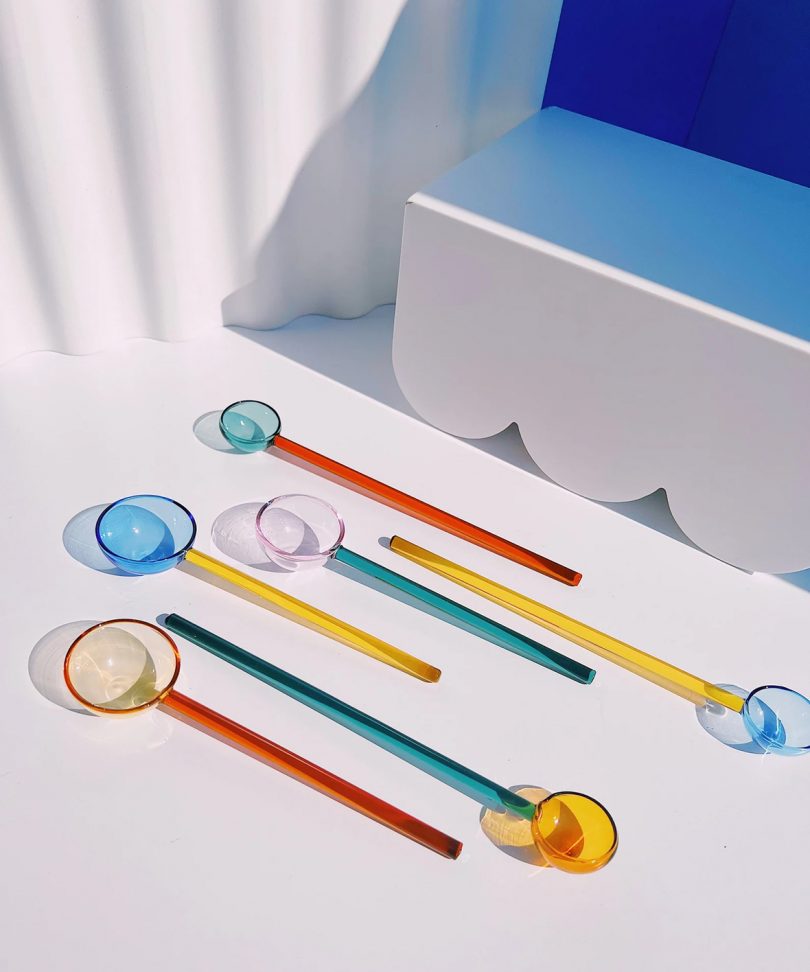 six colorful glass spoons